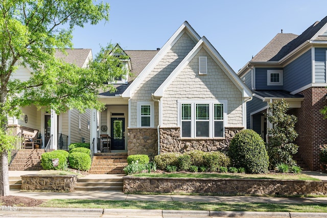 5638 Wade Park Blvd, Raleigh, NC 27607 - craftsman-style house with a shingled roof and stone siding