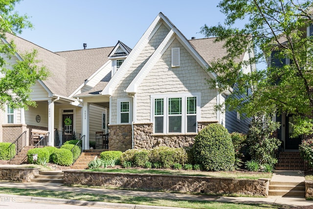 5638 Wade Park Blvd, Raleigh, NC 27607 - craftsman house with a shingled roof, stone siding, and stairway