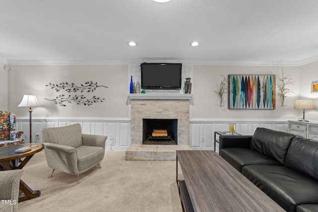 2901 Ceremonial Ct, Raleigh, NC 27615 - carpeted living room featuring crown molding, a decorative wall, a fireplace, recessed lighting, and wainscoting
