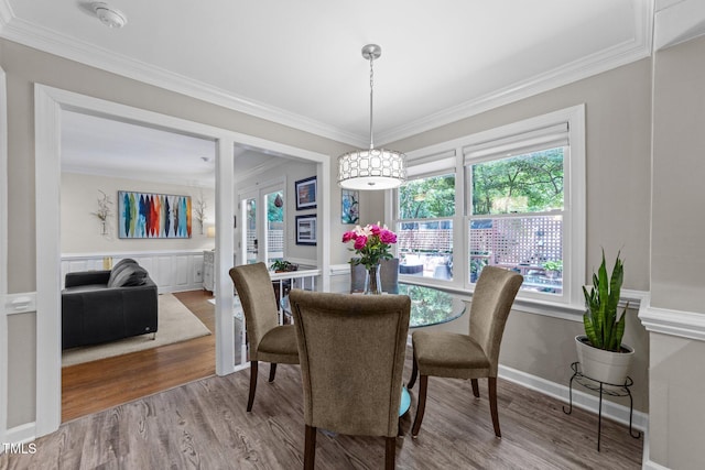 2901 Ceremonial Ct, Raleigh, NC 27615 - dining room featuring crown molding, wood finished floors, and baseboards