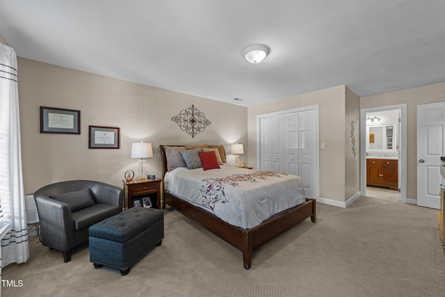 2901 Ceremonial Ct, Raleigh, NC 27615 - bedroom featuring light colored carpet, a closet, baseboards, and ensuite bath
