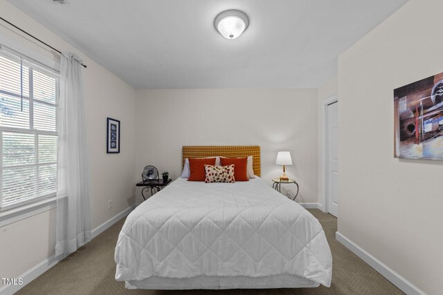 2901 Ceremonial Ct, Raleigh, NC 27615 - carpeted bedroom with baseboards