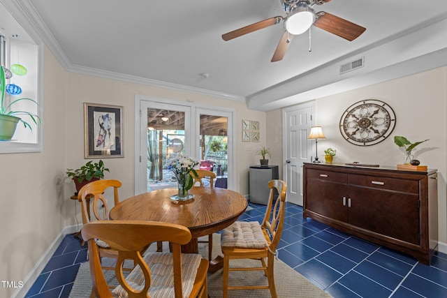 2901 Ceremonial Ct, Raleigh, NC 27615 - dining room with dark tile patterned floors, a ceiling fan, baseboards, and ornamental molding