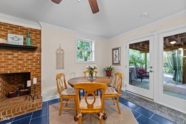 2901 Ceremonial Ct, Raleigh, NC 27615 - dining area with ornamental molding, ceiling fan, dark tile patterned flooring, and baseboards