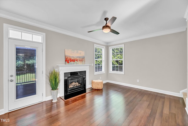 8140 Consella Way, Willow Springs, NC 27592 - unfurnished living room with a ceiling fan, a fireplace with raised hearth, wood finished floors, crown molding, and baseboards