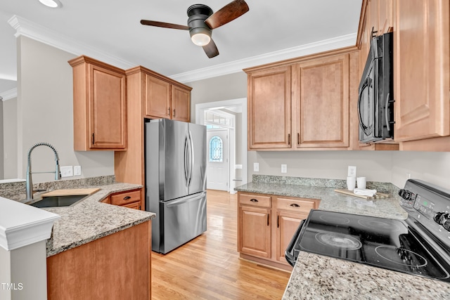 8140 Consella Way, Willow Springs, NC 27592 - kitchen featuring freestanding refrigerator, range with electric cooktop, black microwave, a sink, and ceiling fan
