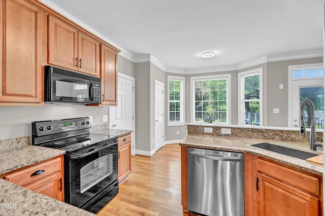 8140 Consella Way, Willow Springs, NC 27592 - kitchen featuring black appliances, a sink, light wood finished floors, ornamental molding, and light stone counters