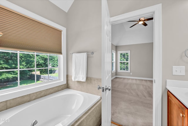 8140 Consella Way, Willow Springs, NC 27592 - full bath featuring lofted ceiling, vanity, a bath, a ceiling fan, and baseboards