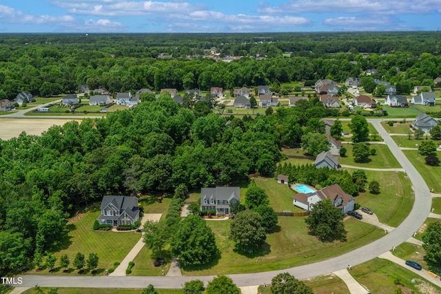 8140 Consella Way, Willow Springs, NC 27592 - aerial view of residential area featuring a heavily wooded area