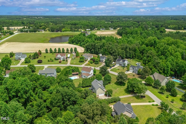 8140 Consella Way, Willow Springs, NC 27592 - aerial perspective of suburban area with a forest and a large body of water