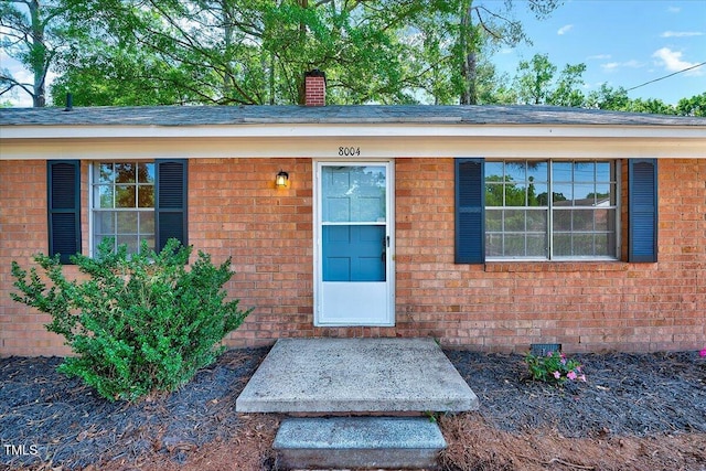 8004 Summit Dr, Goldsboro, NC 27530 - property entrance featuring brick siding and a chimney