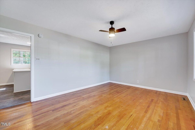 8004 Summit Dr, Goldsboro, NC 27530 - empty room featuring a ceiling fan, wood finished floors, and baseboards