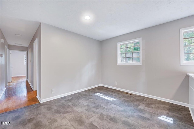 8004 Summit Dr, Goldsboro, NC 27530 - spare room featuring healthy amount of natural light and baseboards
