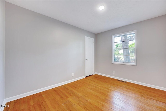 8004 Summit Dr, Goldsboro, NC 27530 - spare room with baseboards and light wood-style floors
