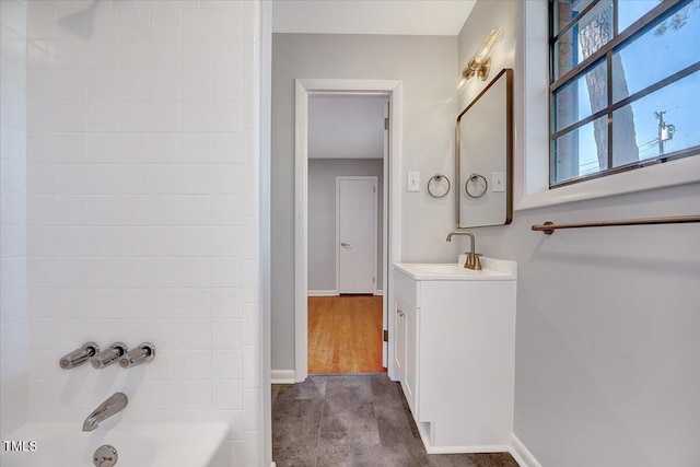 8004 Summit Dr, Goldsboro, NC 27530 - bathroom with vanity, baseboards, and bathtub / shower combination