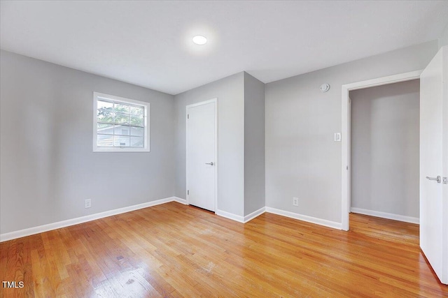 8004 Summit Dr, Goldsboro, NC 27530 - unfurnished bedroom featuring light wood-type flooring and baseboards