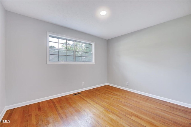 8004 Summit Dr, Goldsboro, NC 27530 - unfurnished room featuring baseboards and light wood-style floors