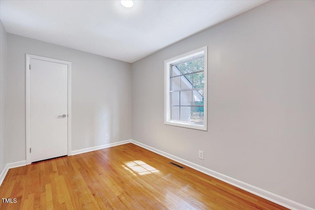 8004 Summit Dr, Goldsboro, NC 27530 - unfurnished room with baseboards and light wood-style flooring