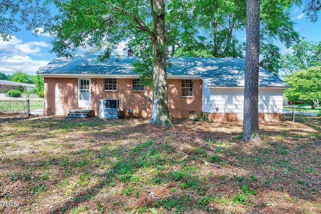 8004 Summit Dr, Goldsboro, NC 27530 - back of house featuring central AC unit and brick siding