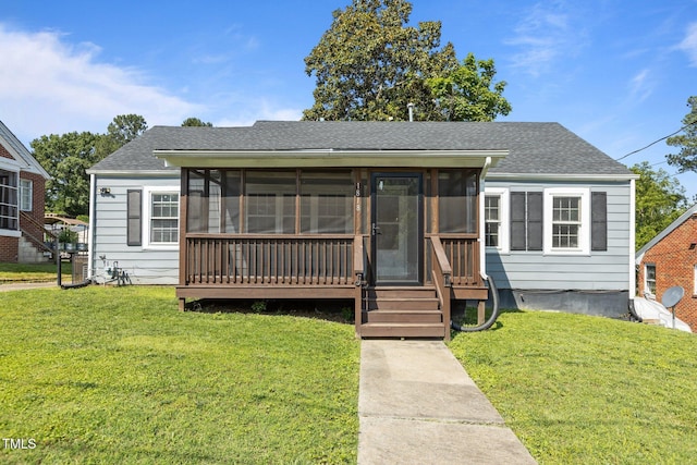 1818 Cecil St, Durham, NC 27707 - bungalow-style home featuring a sunroom, a front lawn, and roof with shingles