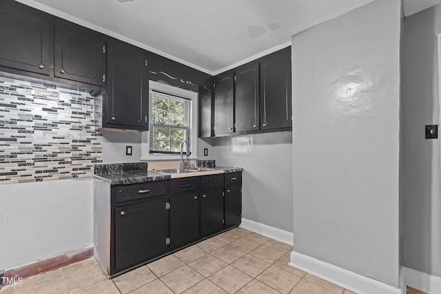 1818 Cecil St, Durham, NC 27707 - kitchen with dark cabinetry and light tile patterned floors
