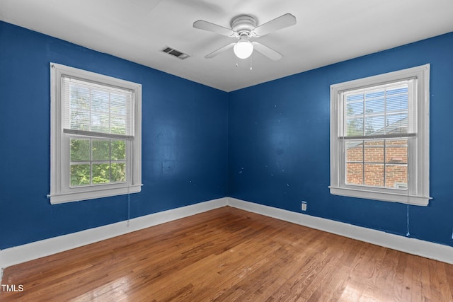 1818 Cecil St, Durham, NC 27707 - empty room with wood finished floors and a ceiling fan