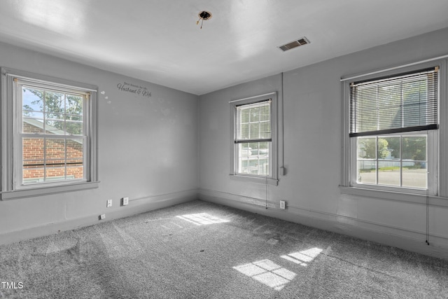 1818 Cecil St, Durham, NC 27707 - carpeted empty room with baseboards