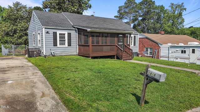 1818 Cecil St, Durham, NC 27707 - bungalow featuring a sunroom, a shingled roof, and a gate