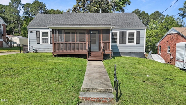 1818 Cecil St, Durham, NC 27707 - bungalow with a sunroom, a front yard, and a shingled roof
