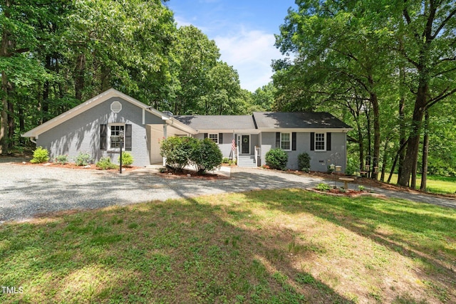 815 Walter Bright Rd, Sanford, NC 27330 - single story home featuring a front yard, brick siding, and entry steps