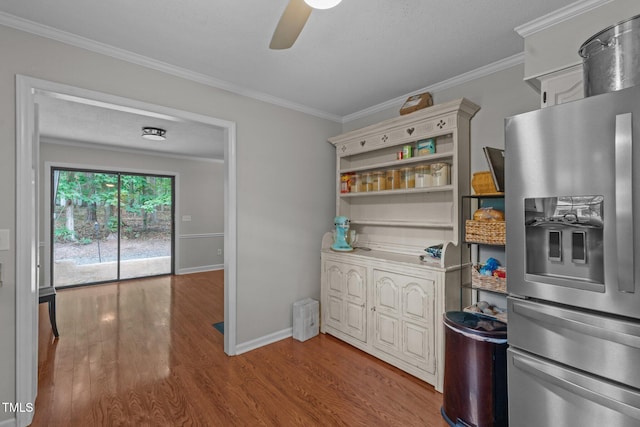 815 Walter Bright Rd, Sanford, NC 27330 - kitchen featuring stainless steel refrigerator with ice dispenser, a ceiling fan, wood finished floors, crown molding, and baseboards
