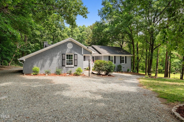 815 Walter Bright Rd, Sanford, NC 27330 - view of front facade with gravel driveway and brick siding