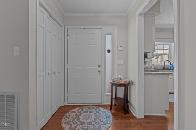 815 Walter Bright Rd, Sanford, NC 27330 - foyer entrance featuring wood finished floors and crown molding