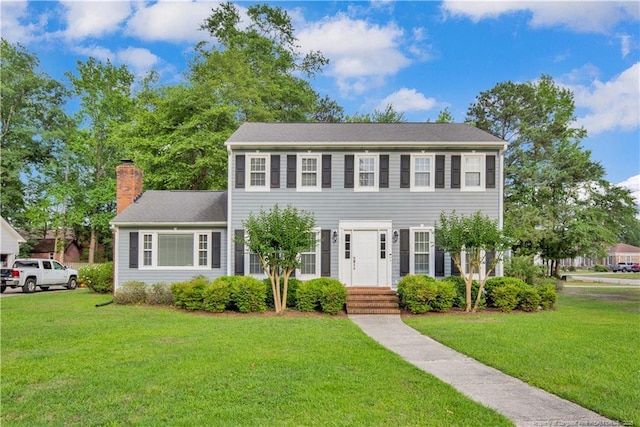 4101 Vann Dr, Lumberton, NC 28358 - colonial house with a chimney and a front lawn