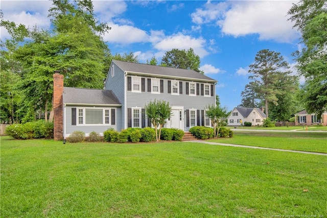 4101 Vann Dr, Lumberton, NC 28358 - colonial house with a chimney and a front lawn