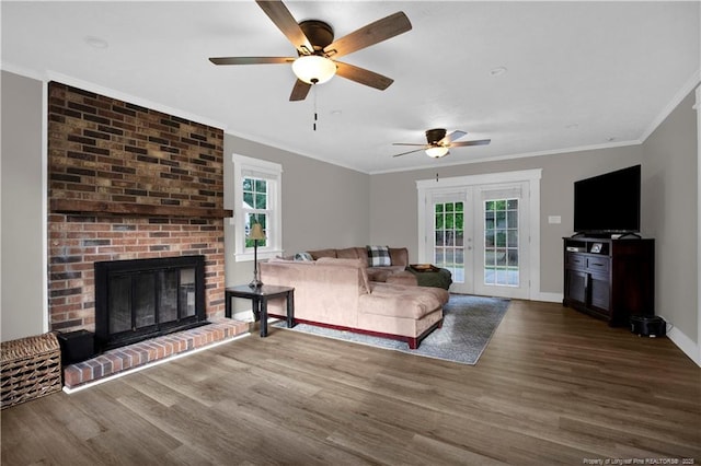 4101 Vann Dr, Lumberton, NC 28358 - living area featuring a fireplace, wood finished floors, a ceiling fan, ornamental molding, and baseboards