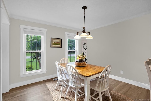 4101 Vann Dr, Lumberton, NC 28358 - dining area featuring wood finished floors, ornamental molding, and baseboards