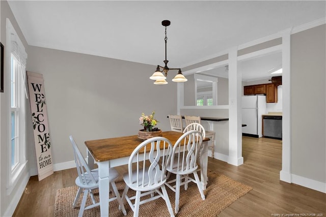 4101 Vann Dr, Lumberton, NC 28358 - dining area featuring wood finished floors, baseboards, and a chandelier