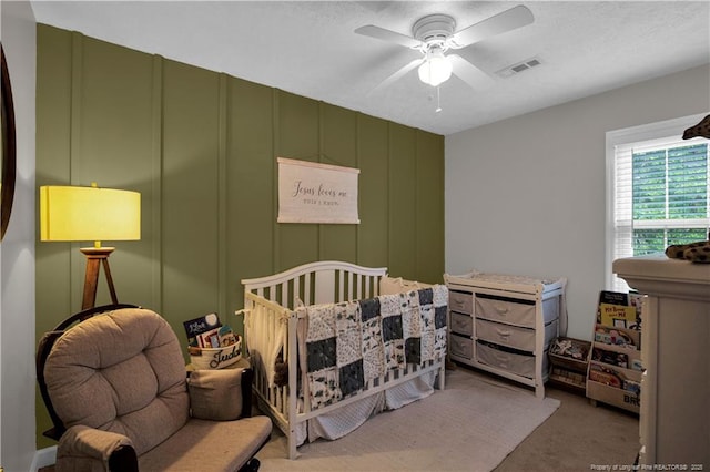 4101 Vann Dr, Lumberton, NC 28358 - carpeted bedroom with a decorative wall and ceiling fan