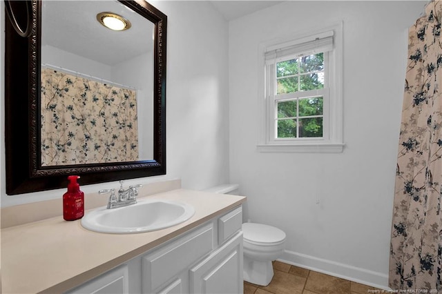 4101 Vann Dr, Lumberton, NC 28358 - bathroom with tile patterned floors, vanity, toilet, baseboards, and a shower with shower curtain