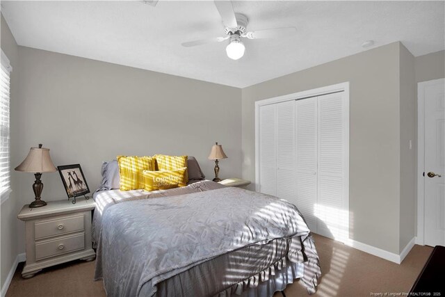 4101 Vann Dr, Lumberton, NC 28358 - bedroom featuring a closet, carpet, baseboards, and a ceiling fan
