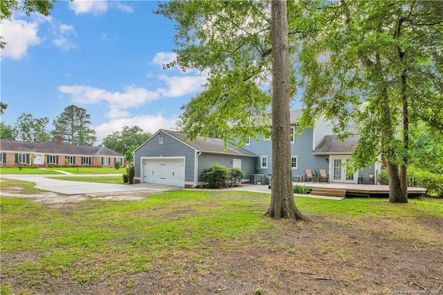 4101 Vann Dr, Lumberton, NC 28358 - traditional-style home featuring concrete driveway, a wooden deck, a front lawn, and an attached garage