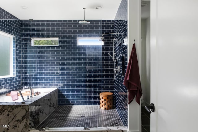 1405 Watts St, Durham, NC 27701 - bathroom featuring a tile shower, tile walls, and tile patterned flooring
