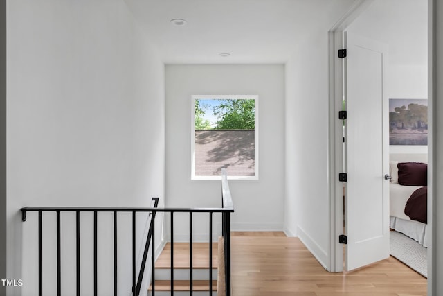 1405 Watts St, Durham, NC 27701 - corridor with light wood-style flooring, an upstairs landing, and baseboards