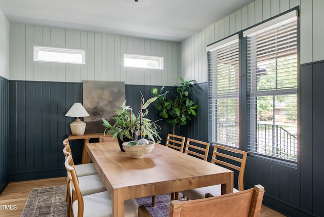 1405 Watts St, Durham, NC 27701 - dining area featuring light wood-type flooring and wood walls