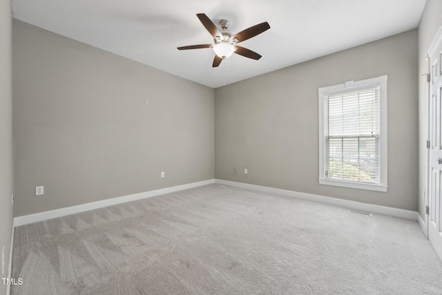 105 Bagley Ln, Dunn, NC 28334 - unfurnished room featuring a ceiling fan, light carpet, and baseboards