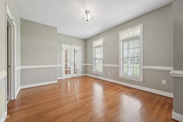 105 Bagley Ln, Dunn, NC 28334 - unfurnished room with french doors, wood finished floors, and baseboards