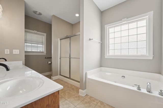 105 Bagley Ln, Dunn, NC 28334 - bathroom featuring a bath, a stall shower, tile patterned flooring, double vanity, and baseboards