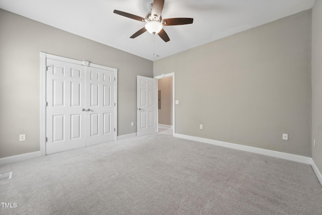 105 Bagley Ln, Dunn, NC 28334 - unfurnished bedroom featuring carpet flooring, a closet, and baseboards