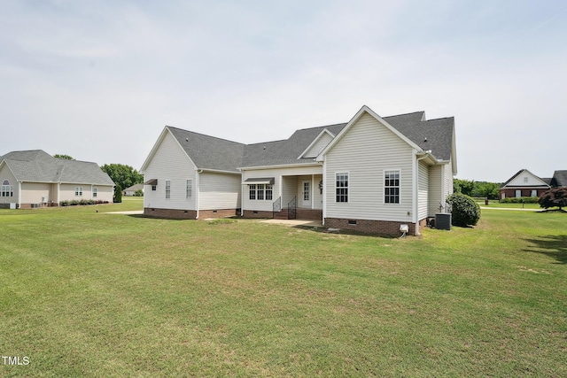 105 Bagley Ln, Dunn, NC 28334 - back of house featuring crawl space, a yard, central AC, and a shingled roof